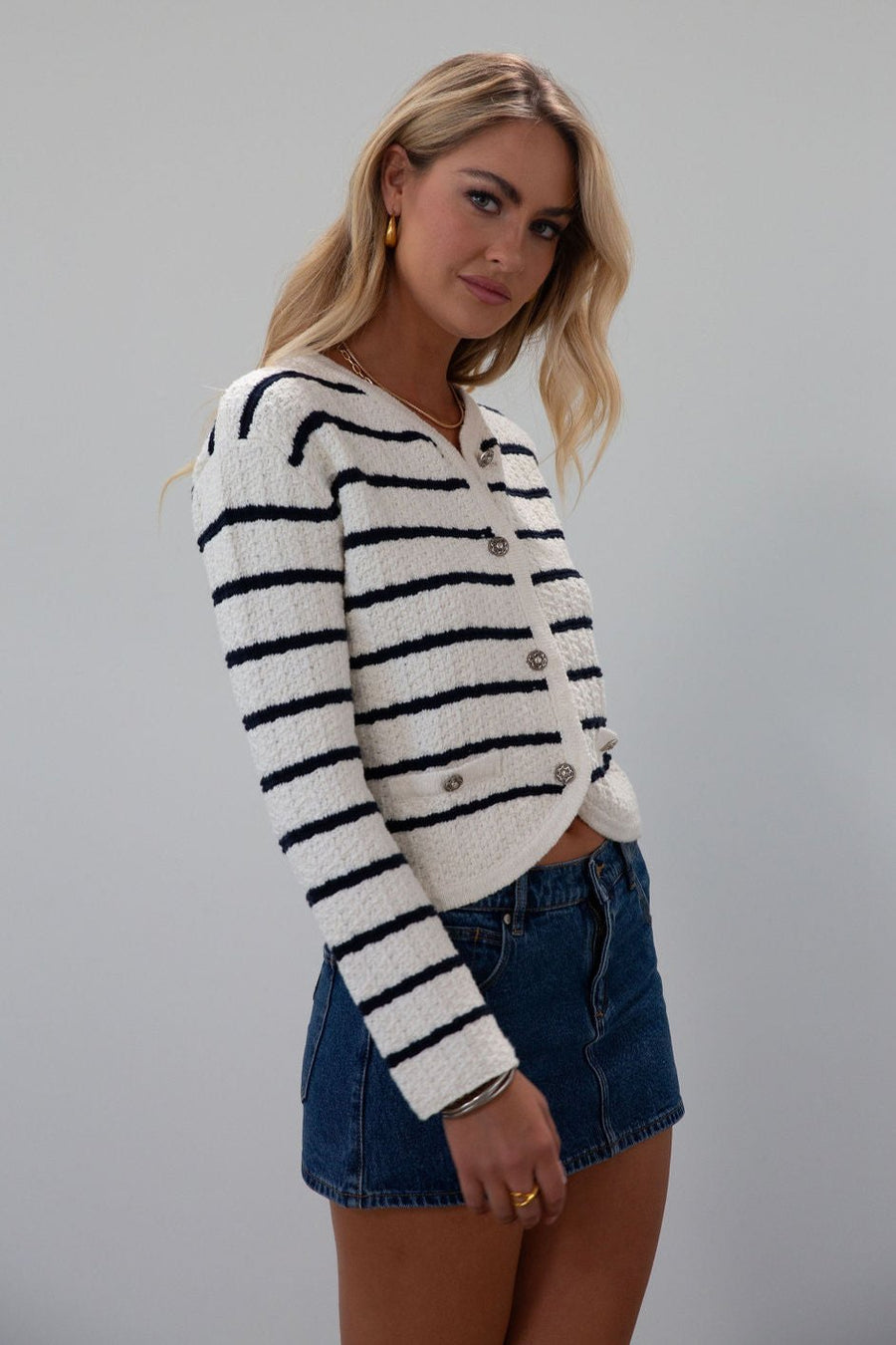 Striped crochet knit cropped cardigan. Front button down closure. Faux front pockets. Unlined. fall outfit. fall top. striped cardigan