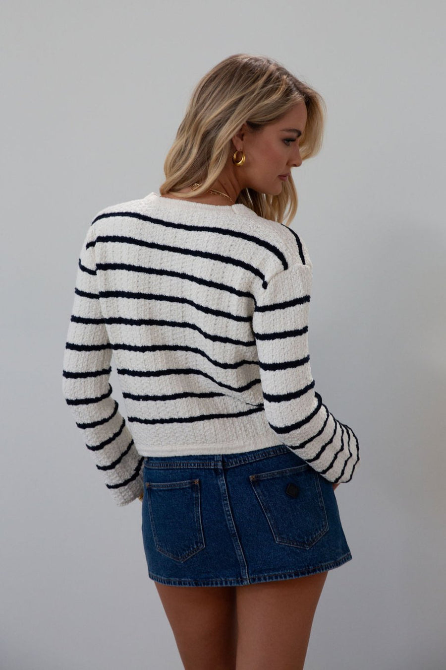 Striped crochet knit cropped cardigan. Front button down closure. Faux front pockets. Unlined. fall outfit. fall top. striped cardigan