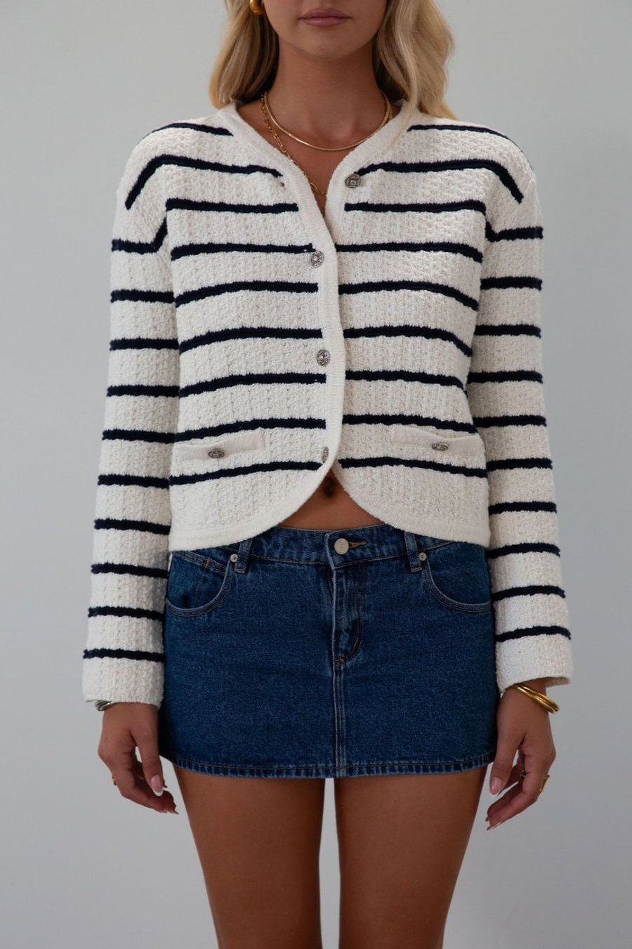 Striped crochet knit cropped cardigan. Front button down closure. Faux front pockets. Unlined. fall outfit. fall top. striped cardigan