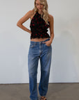 Floral printed chiffon crop top. Adjustable halter neckline with tie closure. Adjustable back tie closures. Fully lined. rose shirt. going out top. fall top. fall going out top. fall outfit