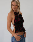 Floral printed chiffon crop top. Adjustable halter neckline with tie closure. Adjustable back tie closures. Fully lined. rose shirt. going out top. fall top. fall going out top. fall outfit