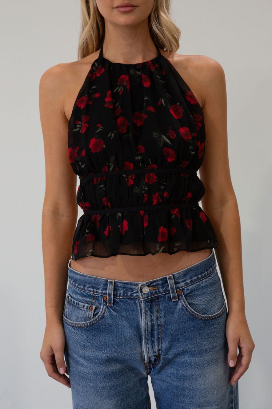 Floral printed chiffon crop top. Adjustable halter neckline with tie closure. Adjustable back tie closures. Fully lined. rose shirt. going out top. fall top. fall going out top. fall outfit