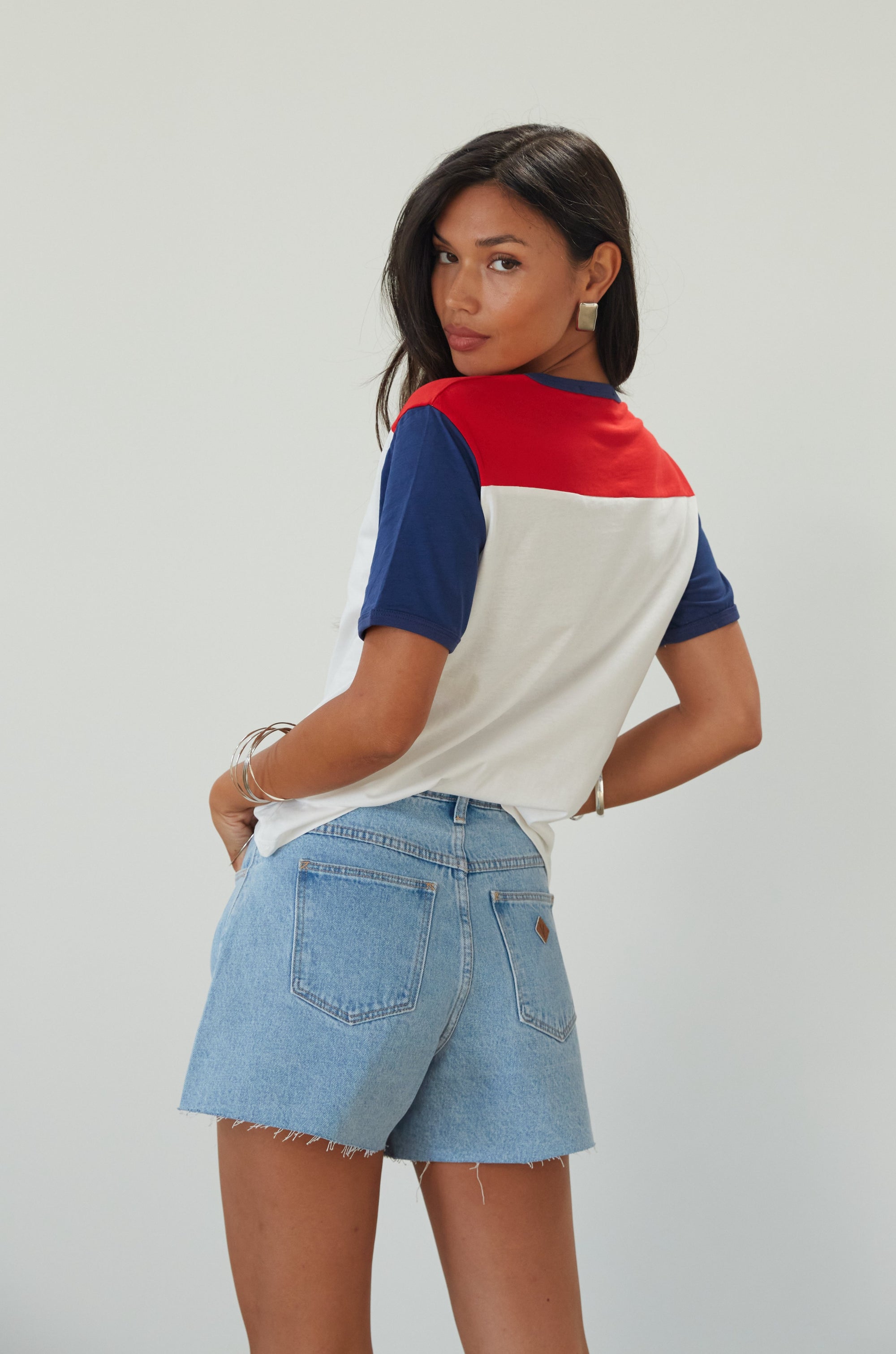 Denim shorts. Button and zipper fly. Five pocket construction. Raw edge hem. Unlined. summer shorts. denim shorts