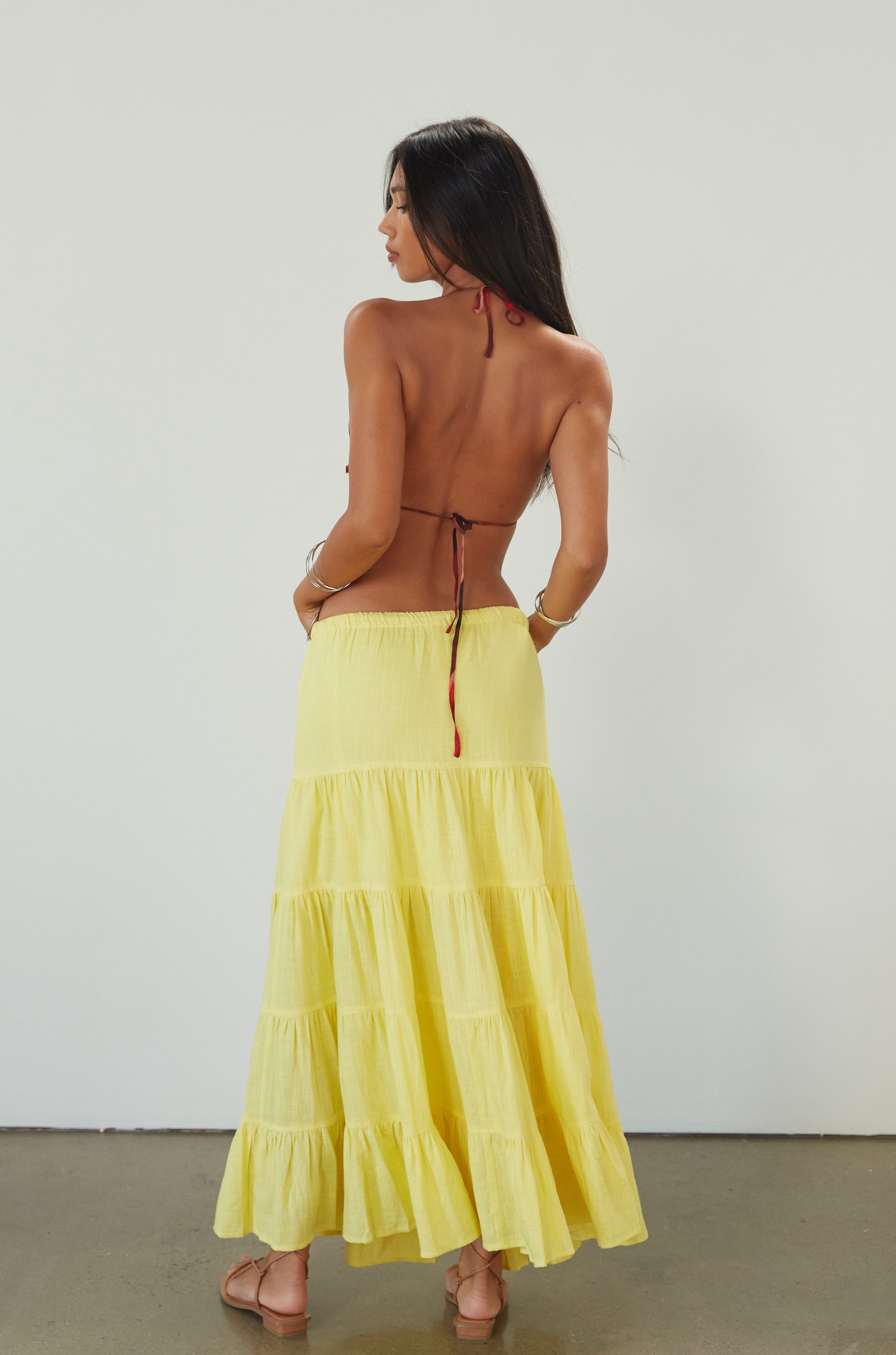 Woven tiered maxi skirt. Elastic waist with drawstring closure. Partially lined. yellow maxi skirt. summer maxi skirt. 
