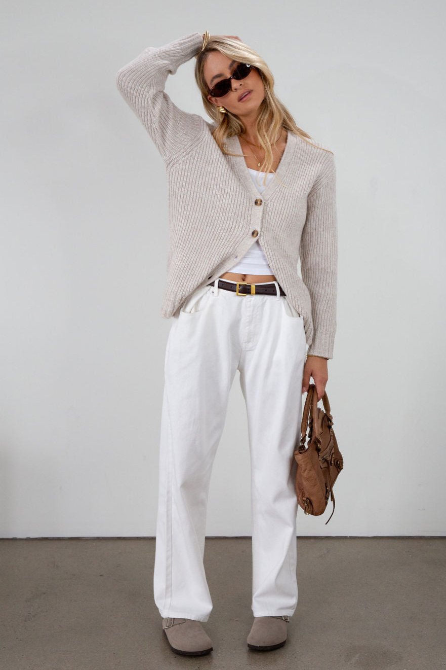Fuzzy heather crochet knit cardigan. Front button down closures. Unlined.