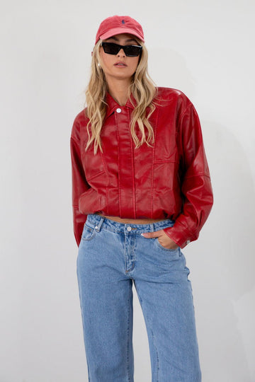 Red Vegan leather bomber jacket. Collar neckline. Snap button long sleeve closures. Front snap button down closures. Front pockets. Elastic hem. Fully lined. fall jacket. fall outfit