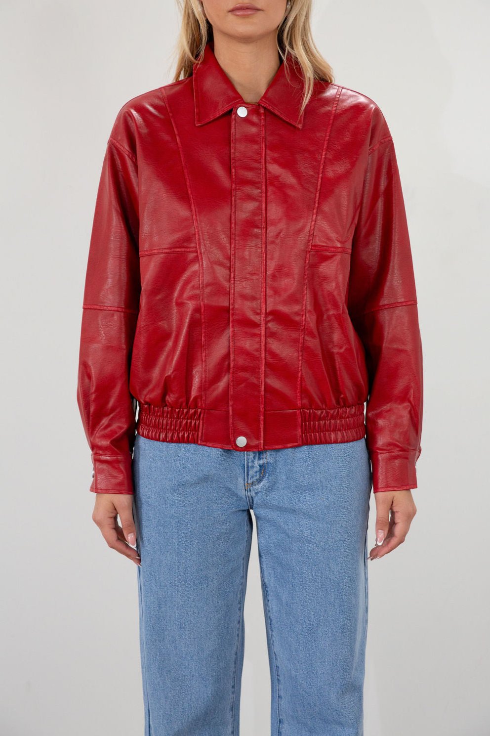 Red Vegan leather bomber jacket. Collar neckline. Snap button long sleeve closures. Front snap button down closures. Front pockets. Elastic hem. Fully lined. fall jacket. fall outfit