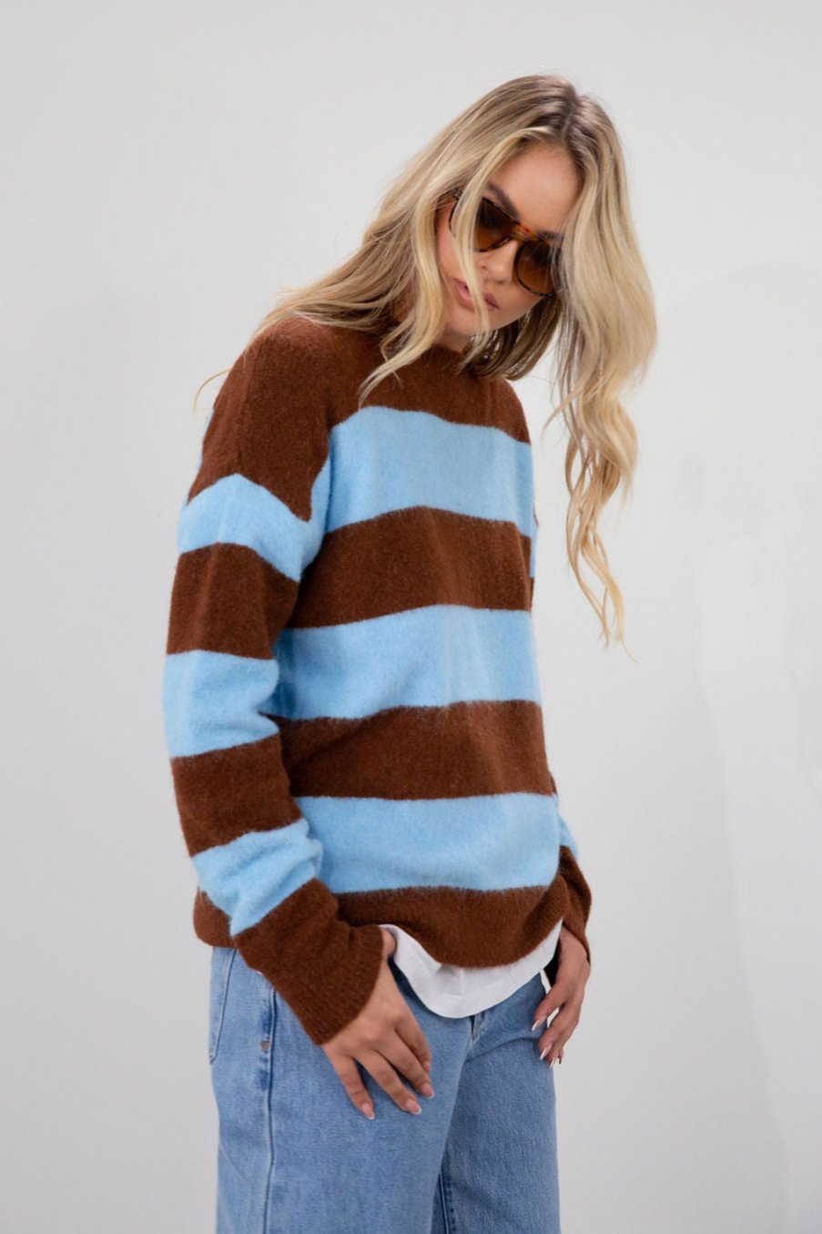 Fuzzy knit striped sweater. Crewneck. Long sleeves. Unlined. blue and brown striped sweater. fall top. fall sweater. fall outfit.