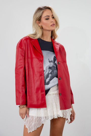 Vegan leather blazer. Single breast. Collar neckline. Front button down closure. Side pockets. Back slit. Fully lined. red leather blazer