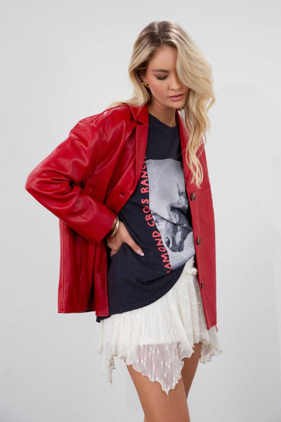 Vegan leather blazer. Single breast. Collar neckline. Front button down closure. Side pockets. Back slit. Fully lined. red leather blazer