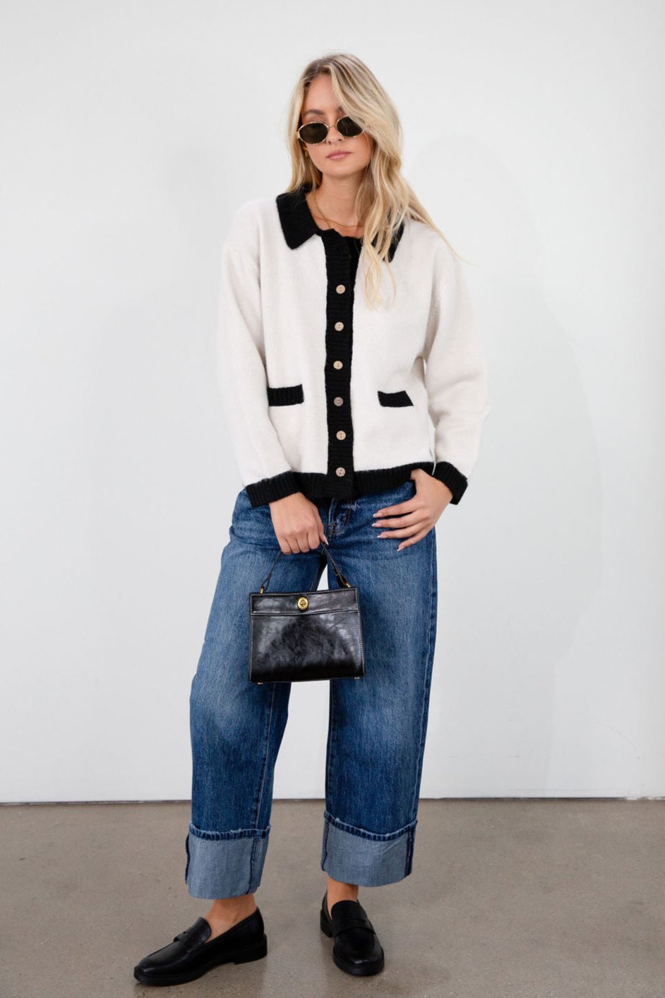 Colorblocked fuzzy crochet knit cardigan. Collar neckline. Front button down closure. Front pockets. Unlined. white cardigan. white and black cardigan. fall sweater. fall outfit. classy cardigan sweater. cardigan sweater