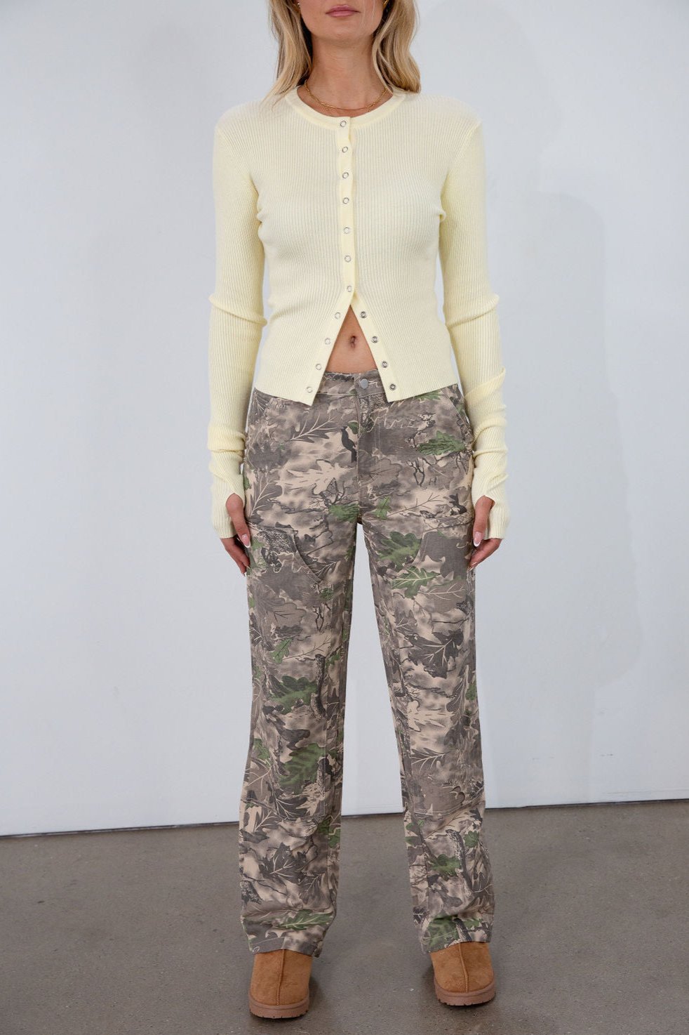 Camo printed cargo jeans. Side and back pockets. Button and zipper fly. Unlined.