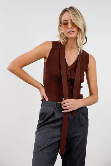 Ribbed knit sleeveless top. V-neckline. Front button down closure. Unlined. Neck tie. brown vest top. top with scarf. fall top.