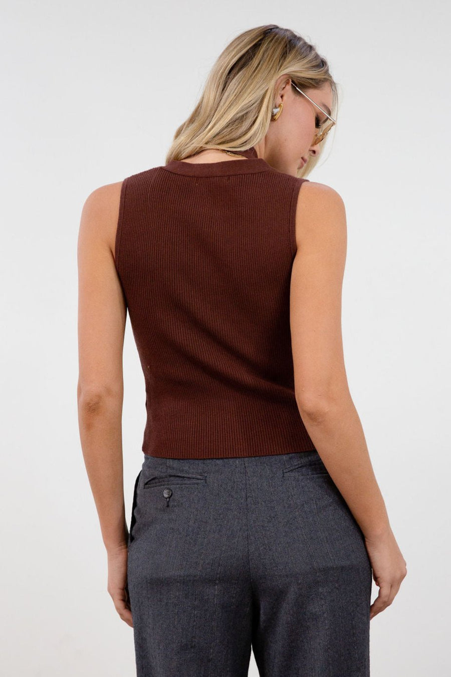 Ribbed knit sleeveless top. V-neckline. Front button down closure. Unlined. Neck tie. brown vest top. top with scarf. fall top.