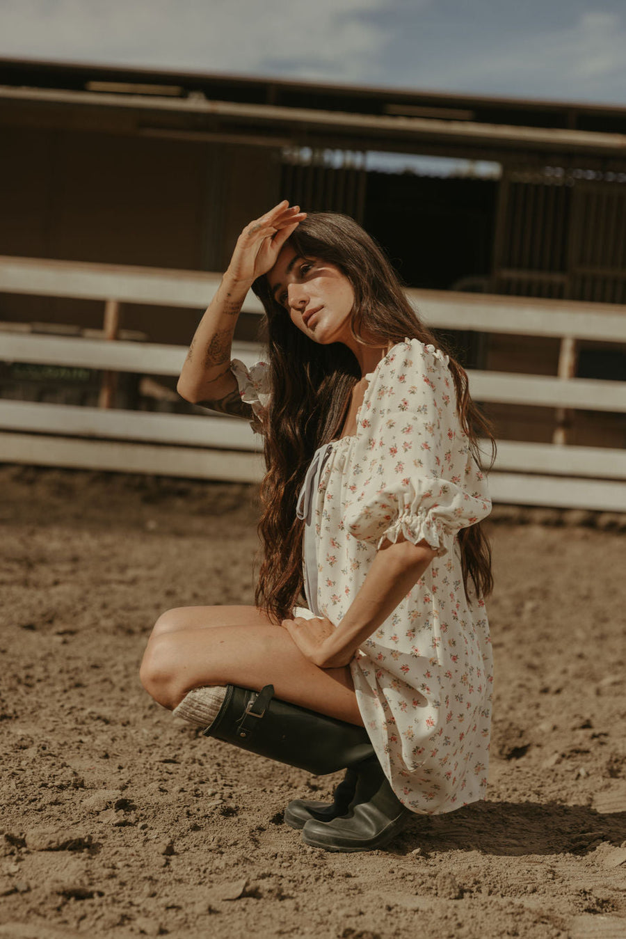 Floral printed woven dress. Elastic neckline. front tie closure. 3/4 sleeves with elastic openings. Unlined. floral mini dress. rumored mini dress. spring mini dress
