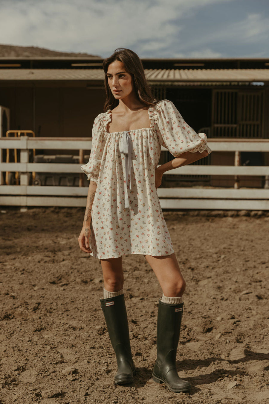 Floral printed woven dress. Elastic neckline. front tie closure. 3/4 sleeves with elastic openings. Unlined. floral mini dress. rumored mini dress. spring mini dress