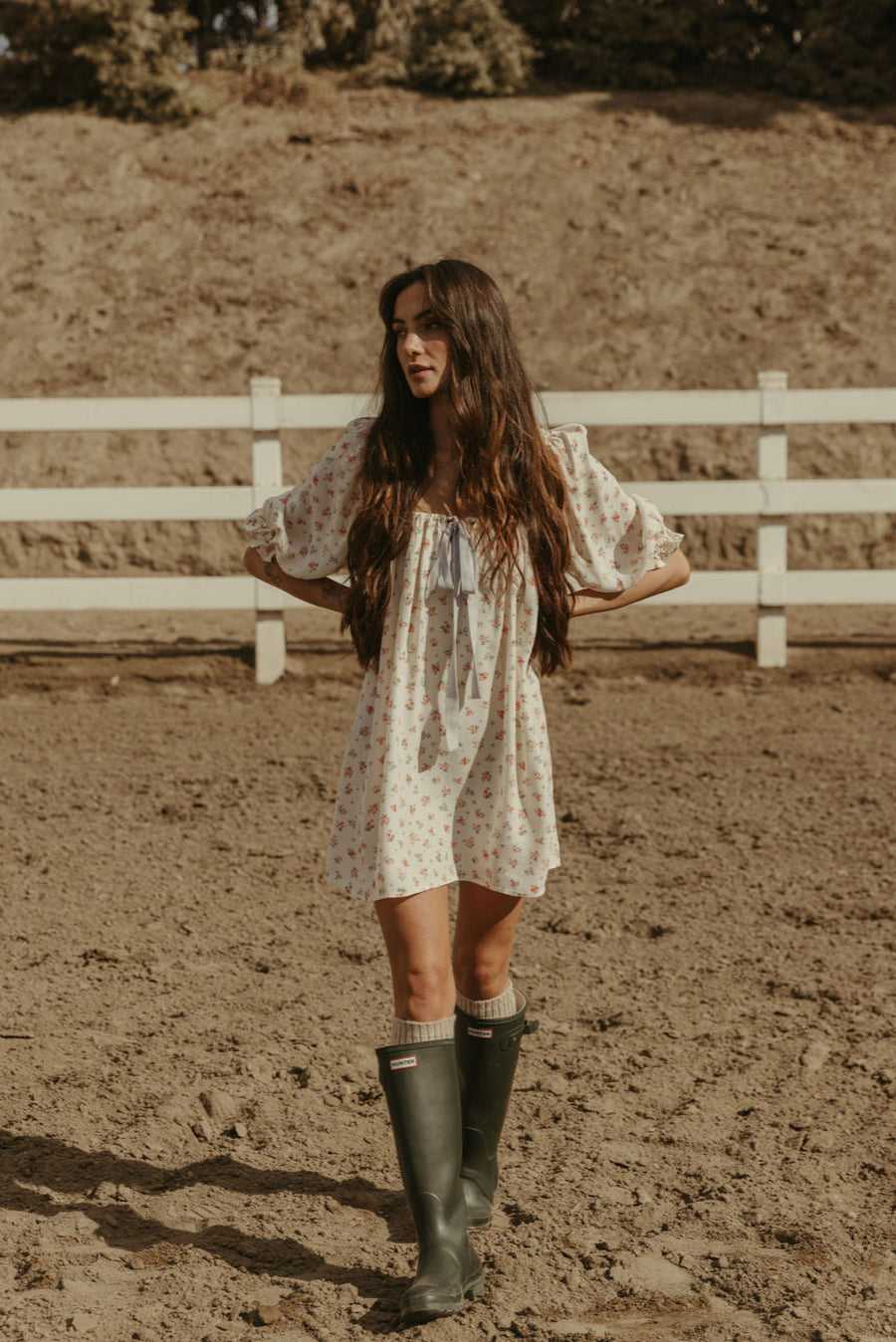 Floral printed woven dress. Elastic neckline. front tie closure. 3/4 sleeves with elastic openings. Unlined. floral mini dress. rumored mini dress. spring mini dress