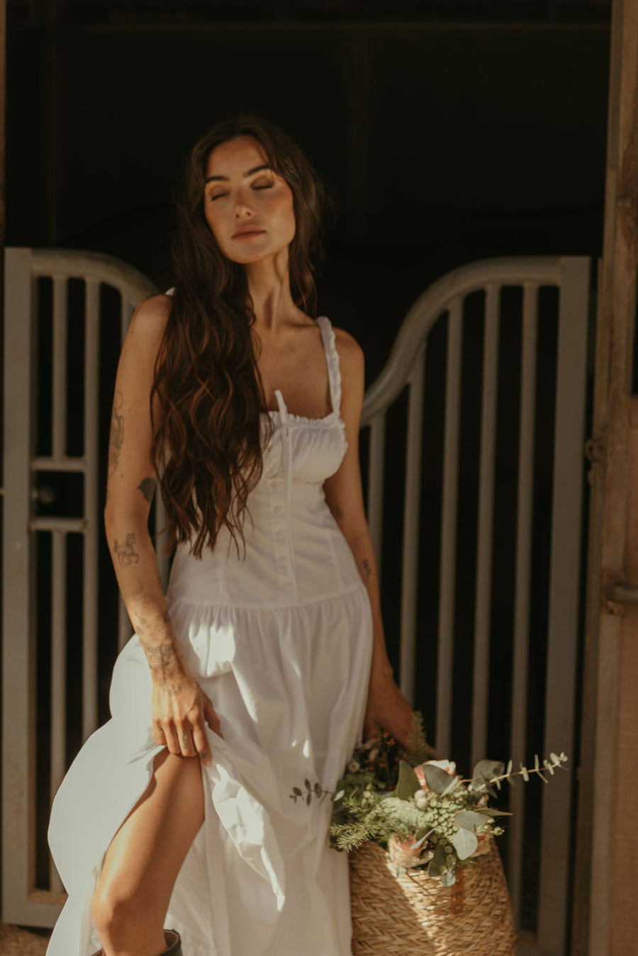 Woven maxi dress. Elastic straps. Faux front tie and button down closures. Tiered skirt. Elastic smocked back panel. Fully lined. white maxi dress