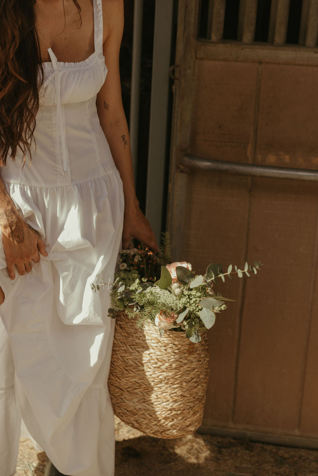 Woven maxi dress. Elastic straps. Faux front tie and button down closures. Tiered skirt. Elastic smocked back panel. Fully lined. white maxi dress