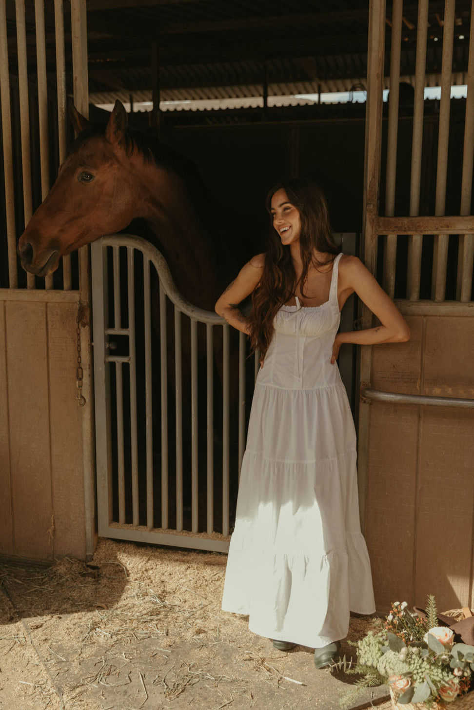 Woven maxi dress. Elastic straps. Faux front tie and button down closures. Tiered skirt. Elastic smocked back panel. Fully lined. white maxi dress