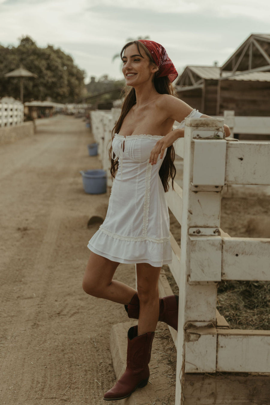 White Woven mini dress. Elastic straps. Inner rubber grip lining. Front tie closures. Crochet trim. Back hook and eye and zipper closures. Unlined. white sun dress