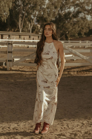 Printed satin maxi dress. Halter neckline with back tie closure. Side zipper closure. Fully lined. horse dress. ranch shoot. 
