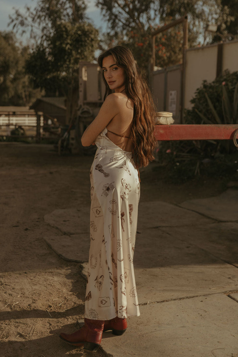 Printed satin maxi dress. Halter neckline with back tie closure. Side zipper closure. Fully lined. horse dress. ranch shoot. 
