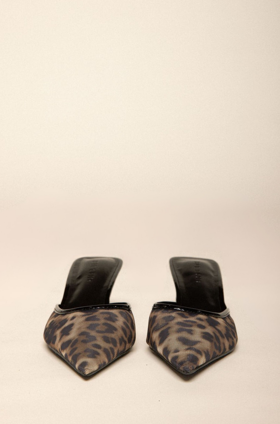 Leopard printed mesh heel
Low kicked-in stiletto heel
Closed pointed toe
Open heel counter
Slip on
Heel height: 2.5"
Synthetic