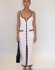 cream Crochet knit maxi dress. Sleeveless. V-neckline. Front button down closures. Faux front pockets. Unlined. cream knit maxi dress. knit button down maxi dress