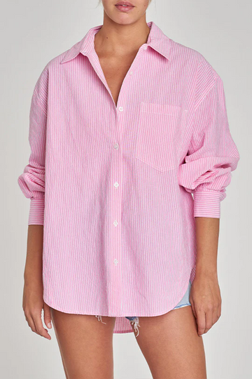 Striped woven shirt. Collar neckline. Long sleeves with button closures. Front button down closures. Front pocket. Unlined. Pink button up. Pink oversized button up top. Throw on shirt. Beach cover up. Pool cover up. Vacation outfit. Summer outfit. Cute summer outfit. Cute casual button up