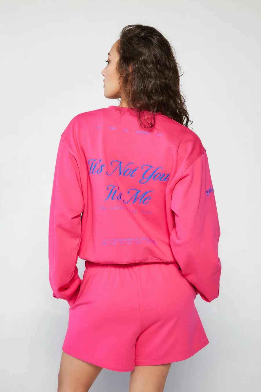 Graphic printed knit sweatshirt. Cropped fit. Unlined. Pink cropped oversized sweater. Airport outfit. Loungewear. Relaxing outfit.